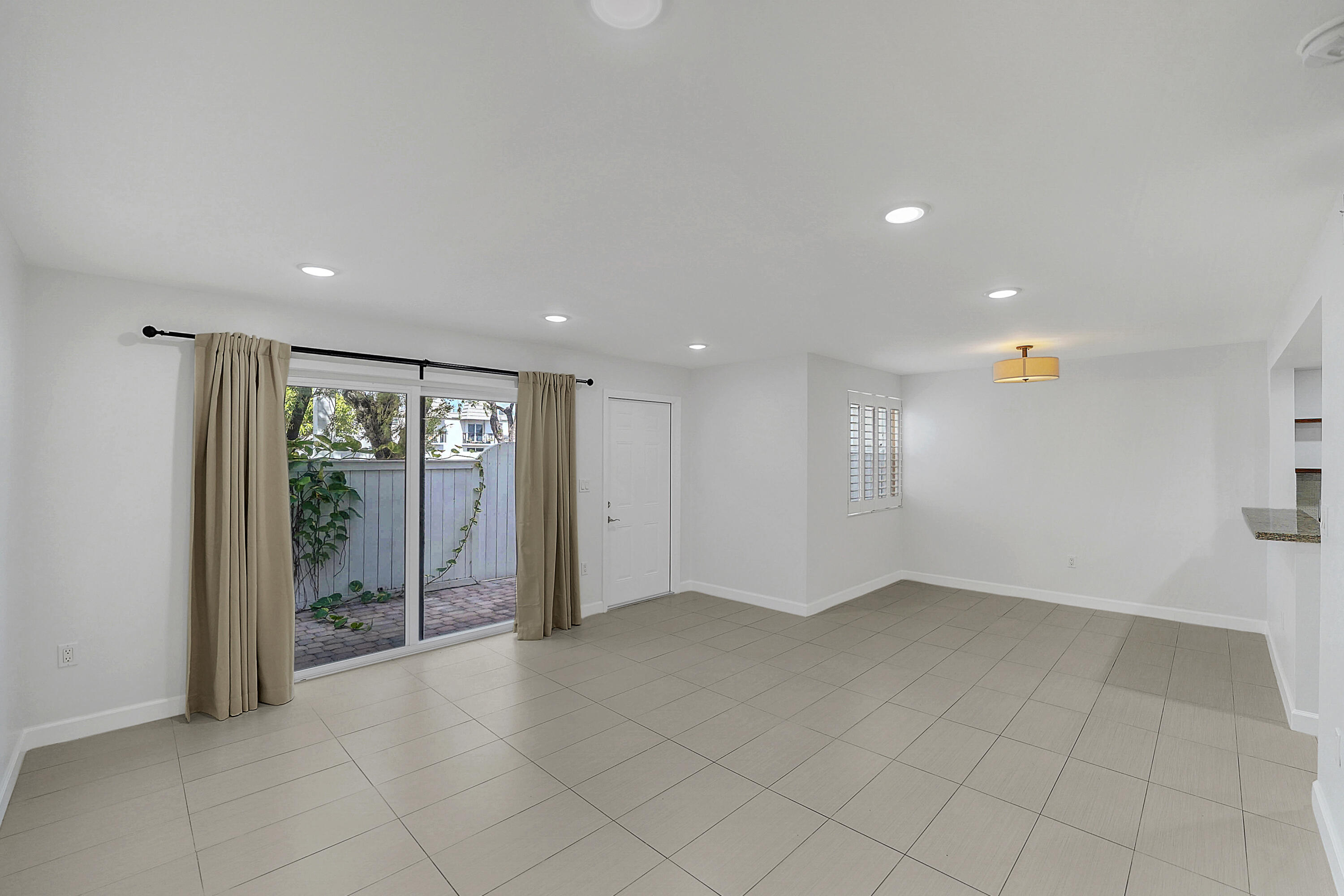 4550 Southwest 68th Ct Circle, Unit 548 Miami, FL 33155 - Photo 22 of 51 a view of an empty room with a window