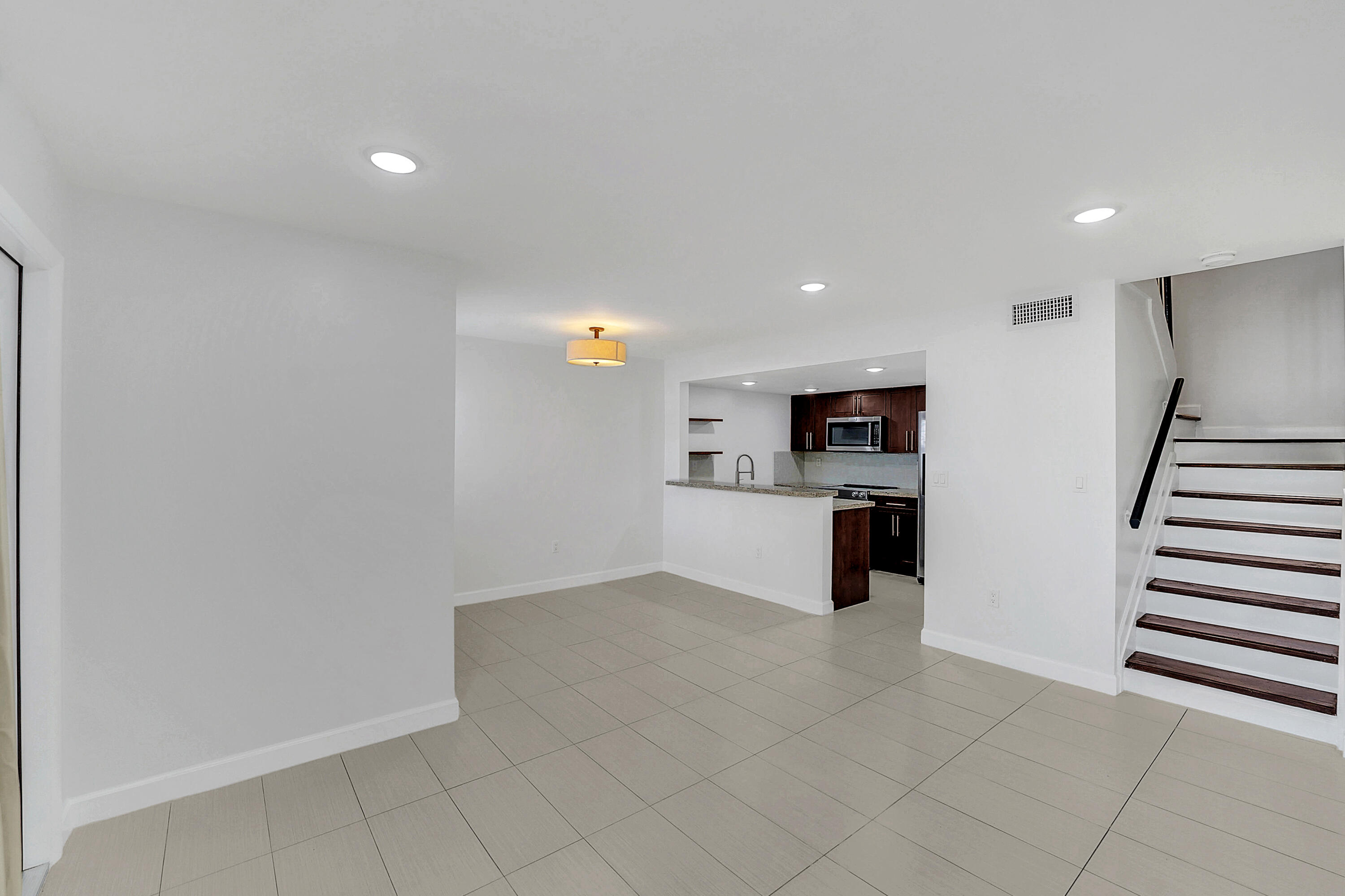 4550 Southwest 68th Ct Circle, Unit 548 Miami, FL 33155 - Photo 23 of 51 a view of kitchen with microwave and cabinets