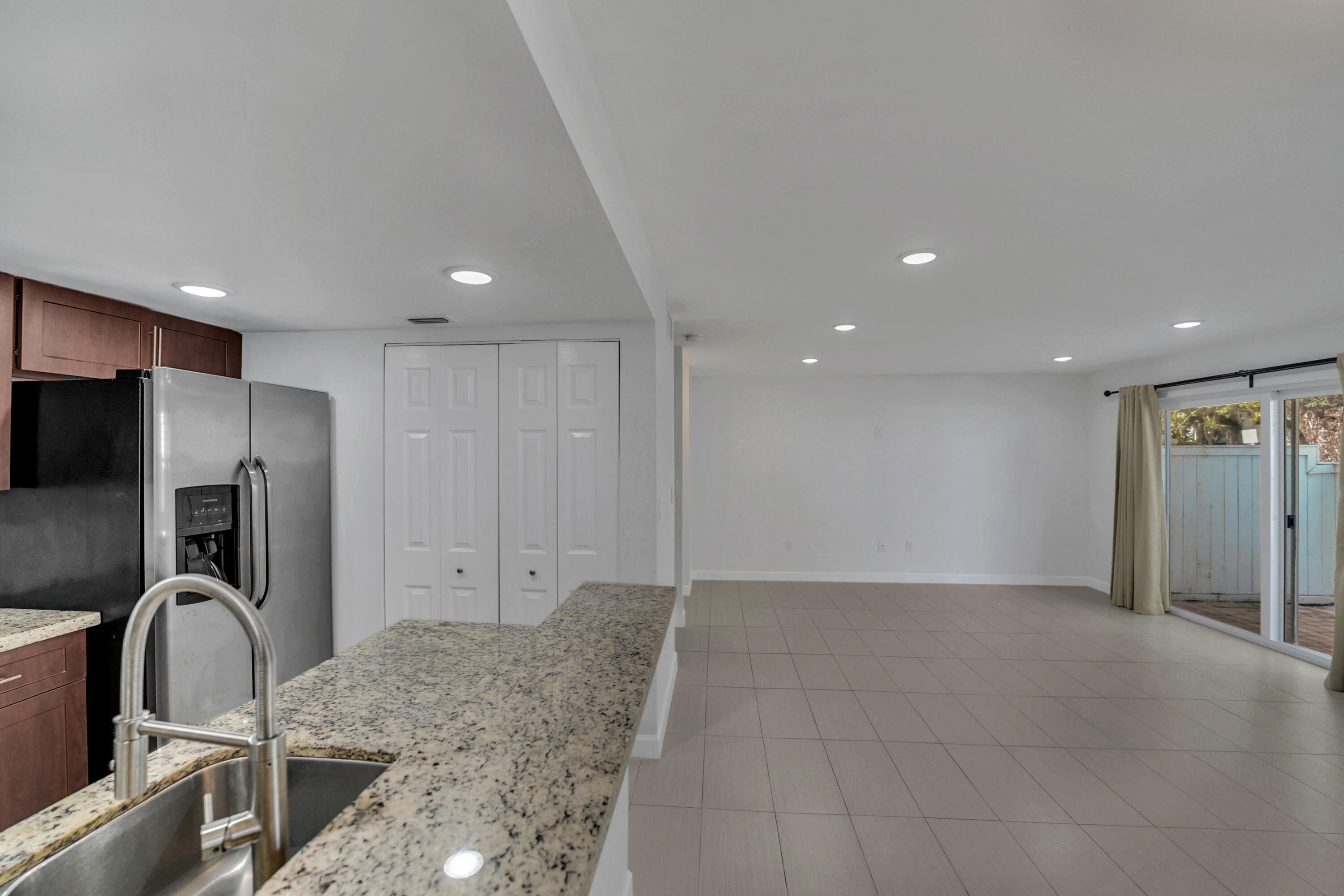 4550 Southwest 68th Ct Circle, Unit 548 Miami, FL 33155 - Photo 26 of 51 a view of a kitchen with a sink and a refrigerator