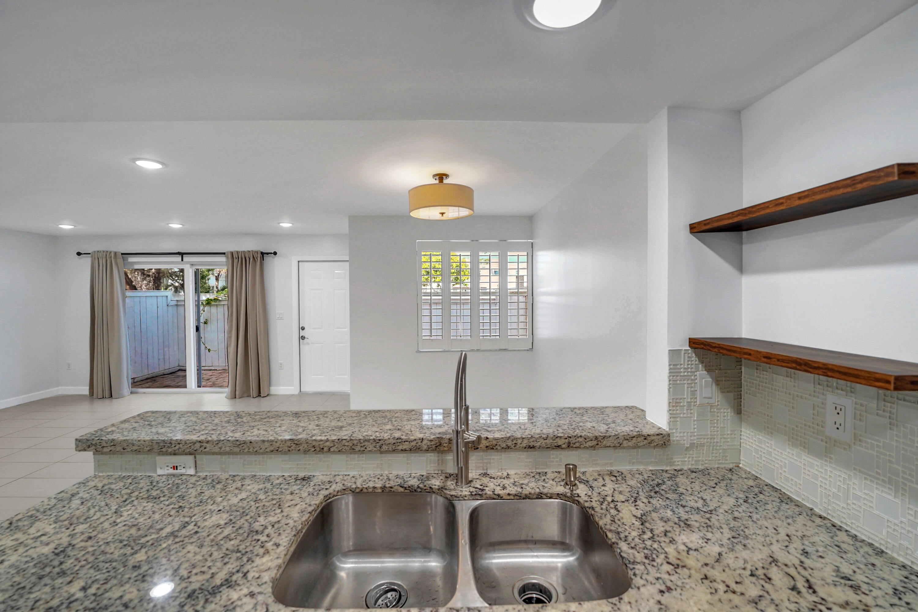 4550 Southwest 68th Ct Circle, Unit 548 Miami, FL 33155 - Photo 31 of 51 a kitchen with a sink and a window