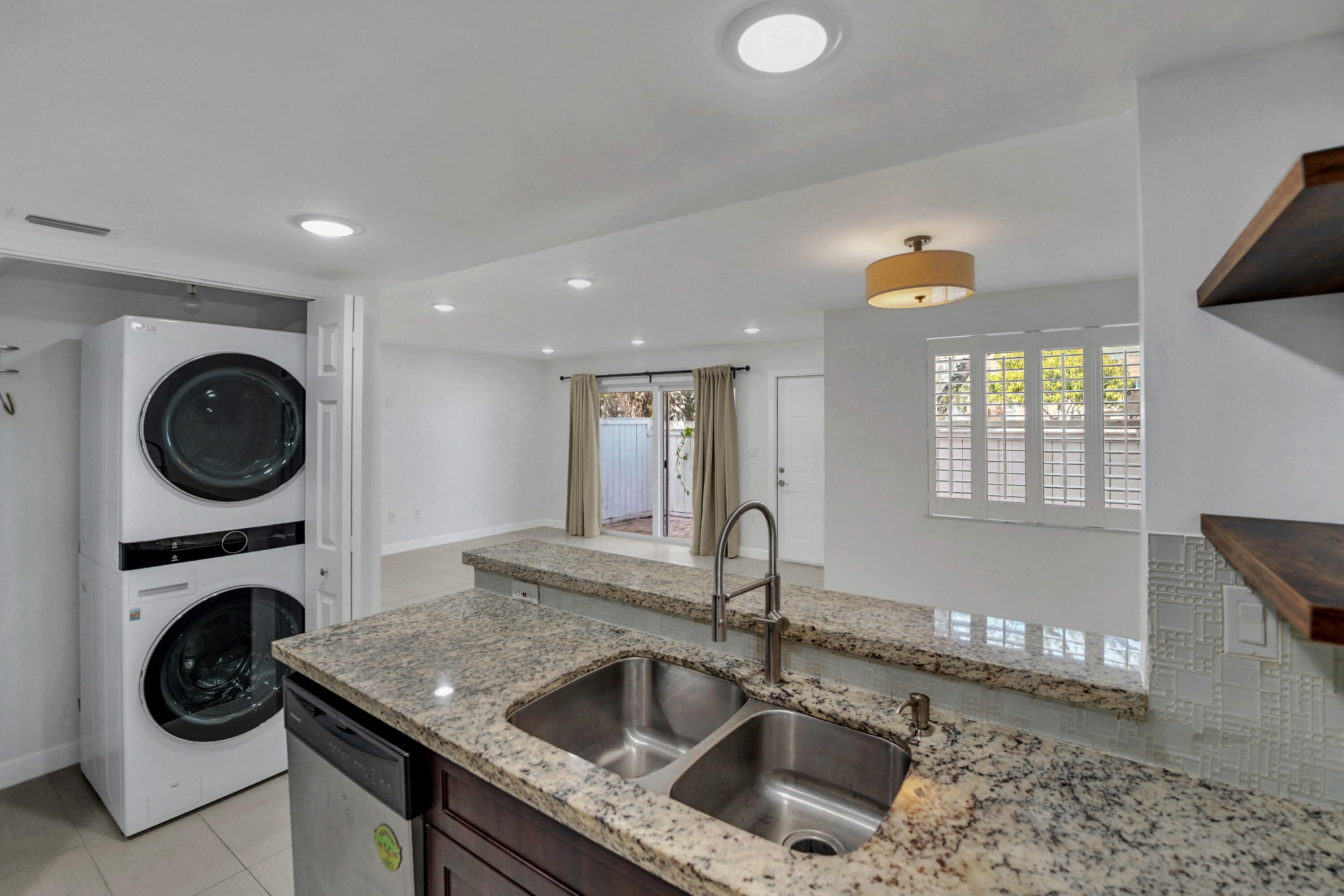 4550 Southwest 68th Ct Circle, Unit 548 Miami, FL 33155 - Photo 32 of 51 a kitchen with a stove a sink and a cabinets
