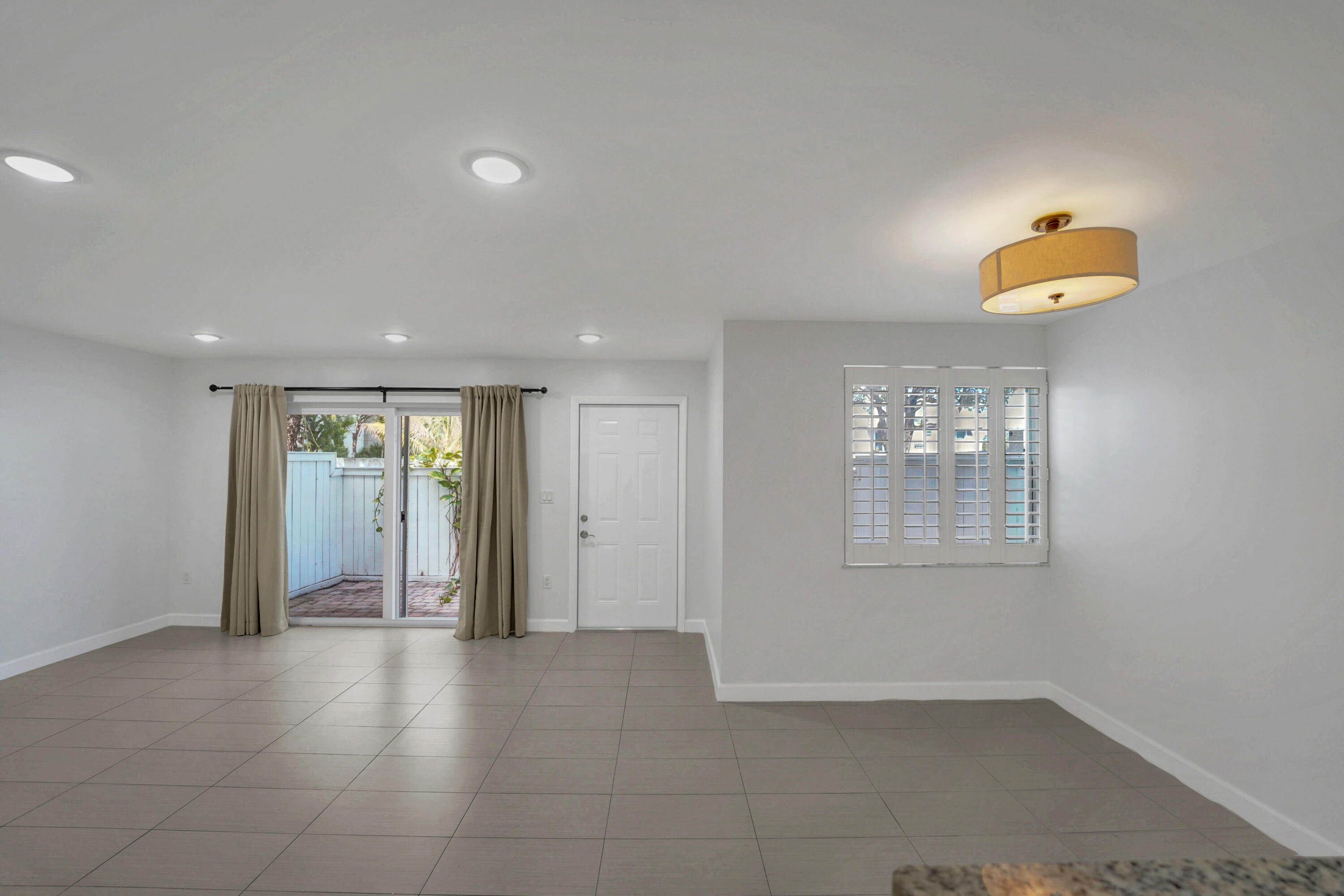 4550 Southwest 68th Ct Circle, Unit 548 Miami, FL 33155 - Photo 34 of 51 a view of an empty room with a window