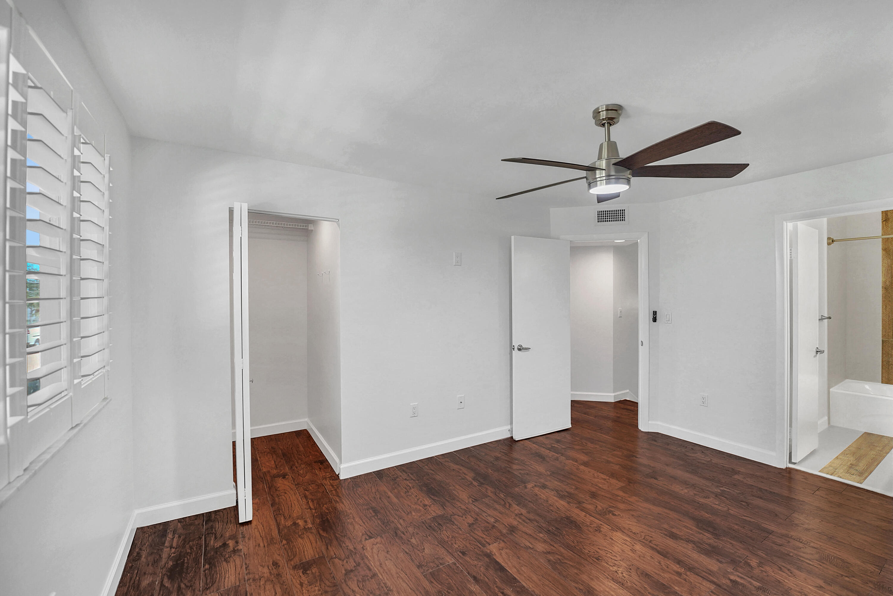 4550 Southwest 68th Ct Circle, Unit 548 Miami, FL 33155 - Photo 4 of 51 wooden floor in an empty room with a window