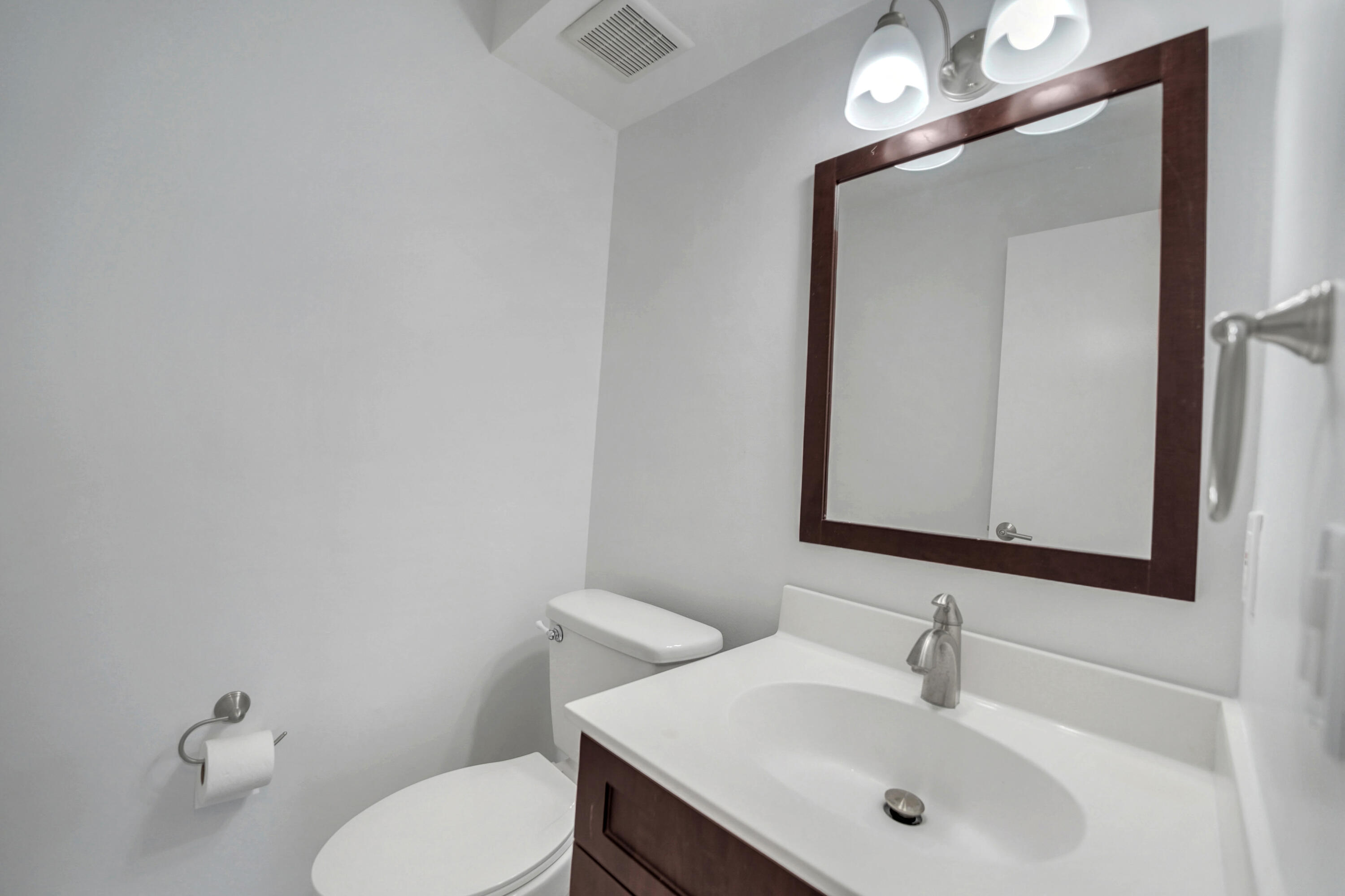 4550 Southwest 68th Ct Circle, Unit 548 Miami, FL 33155 - Photo 43 of 51 a bathroom with a toilet sink and mirror