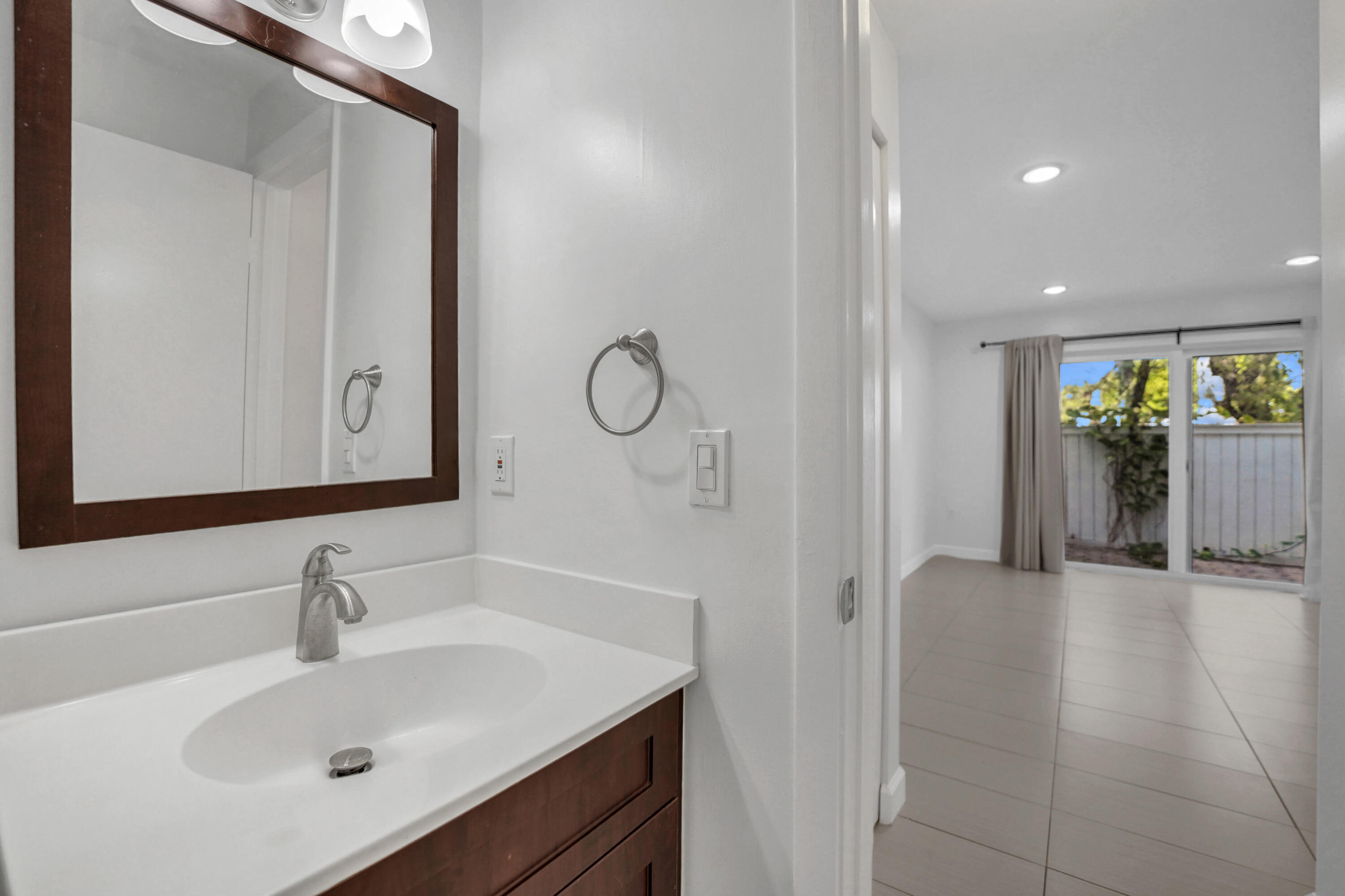 4550 Southwest 68th Ct Circle, Unit 548 Miami, FL 33155 - Photo 44 of 51 a bathroom with a sink and a mirror