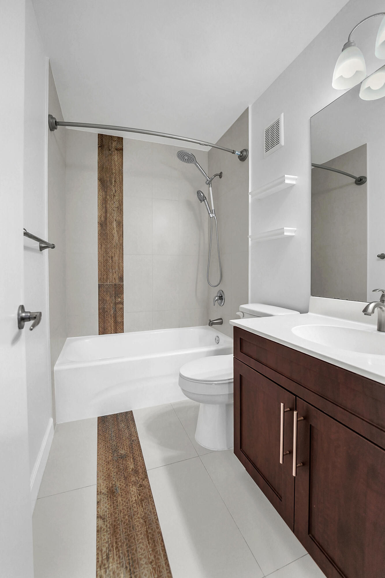 4550 Southwest 68th Ct Circle, Unit 548 Miami, FL 33155 - Photo 8 of 51 a spacious bathroom with a double vanity sink toilet mirror and bathtub