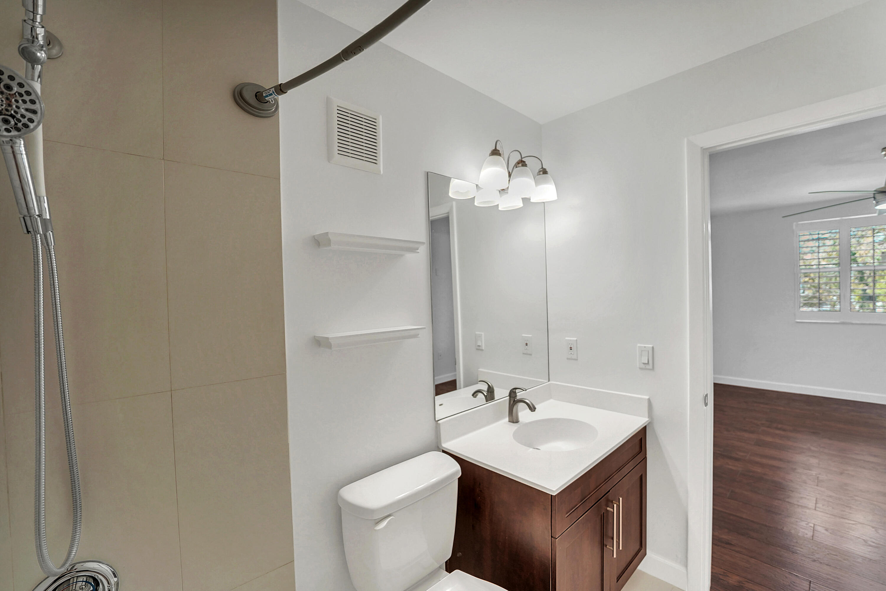 4550 Southwest 68th Ct Circle, Unit 548 Miami, FL 33155 - Photo 9 of 51 a bathroom with a sink toilet and mirror