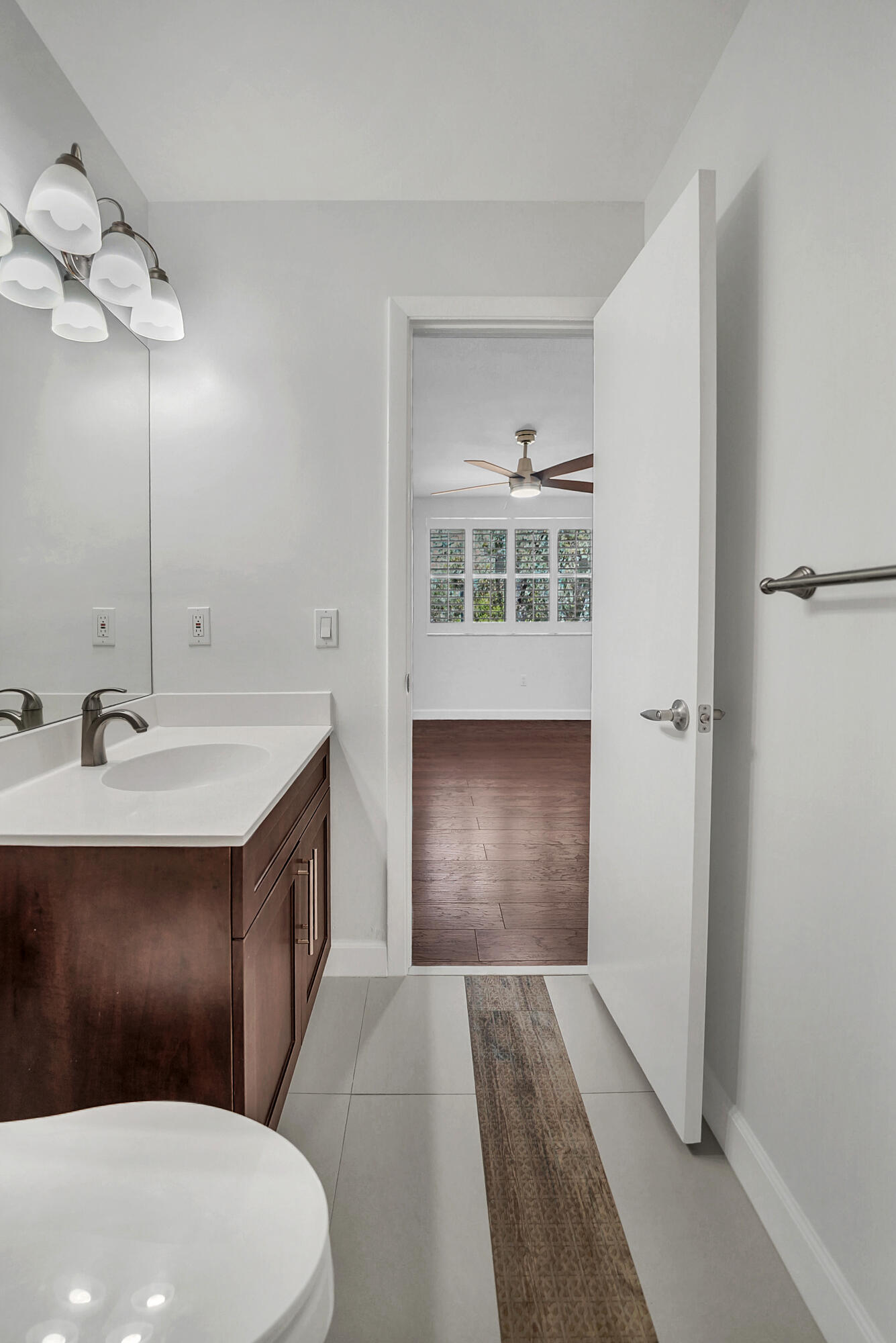 4550 Southwest 68th Ct Circle, Unit 548 Miami, FL 33155 - Photo 10 of 51 a bathroom with a sink vanity granite and toilet