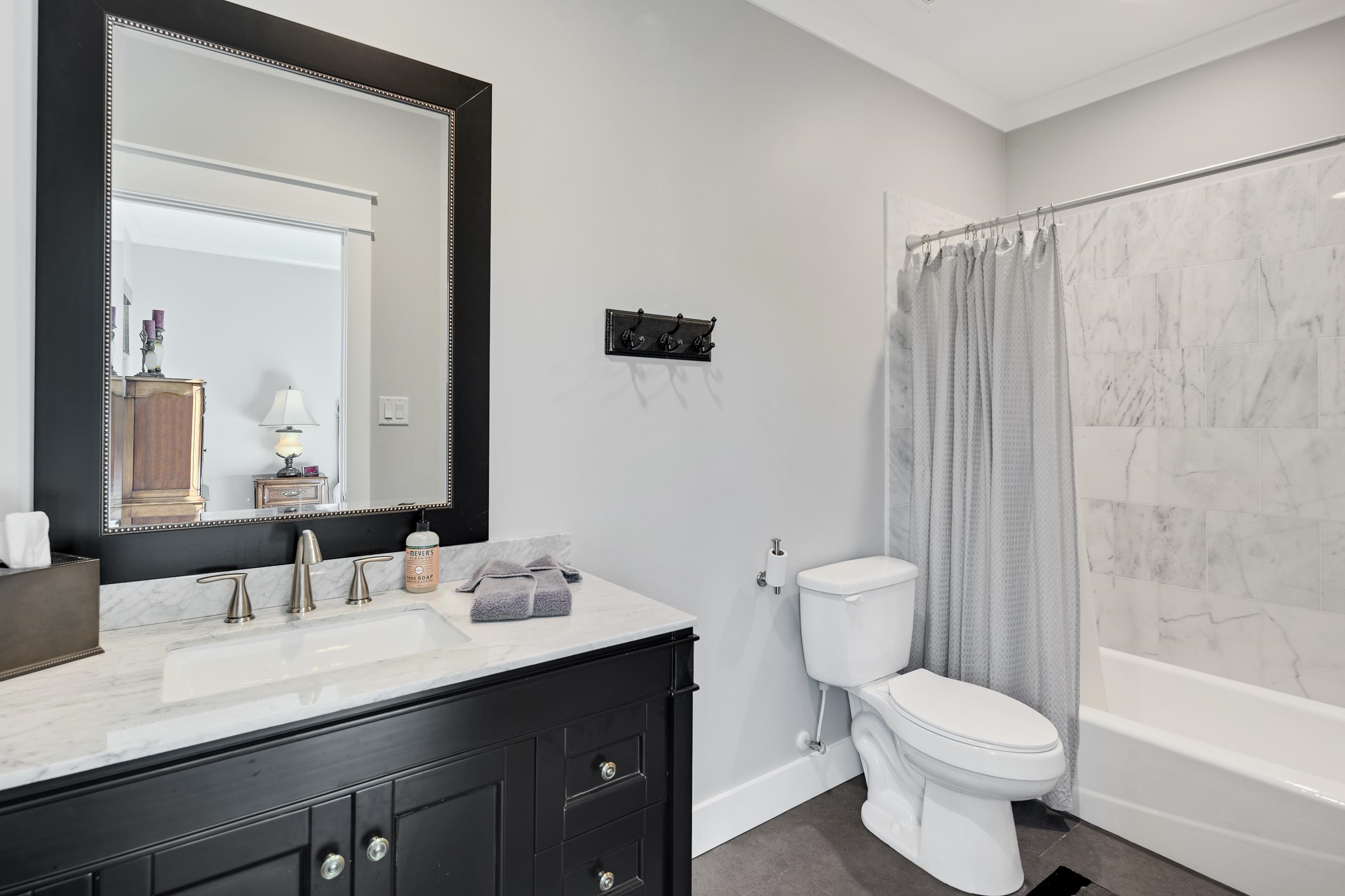170 Twin Lakes Road Piperton, TN 38017 - Photo 14 of 40 Bathroom featuring shower / bathtub combination with curtain and vanity