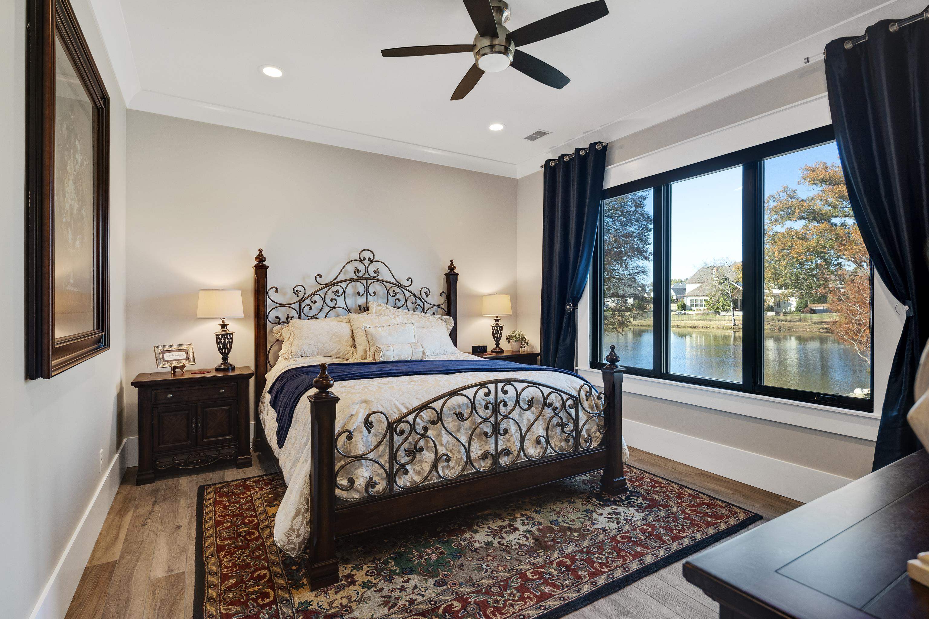 170 Twin Lakes Road Piperton, TN 38017 - Photo 24 of 40 Bedroom with wood finished floors, ceiling fan, a water view, and recessed lighting