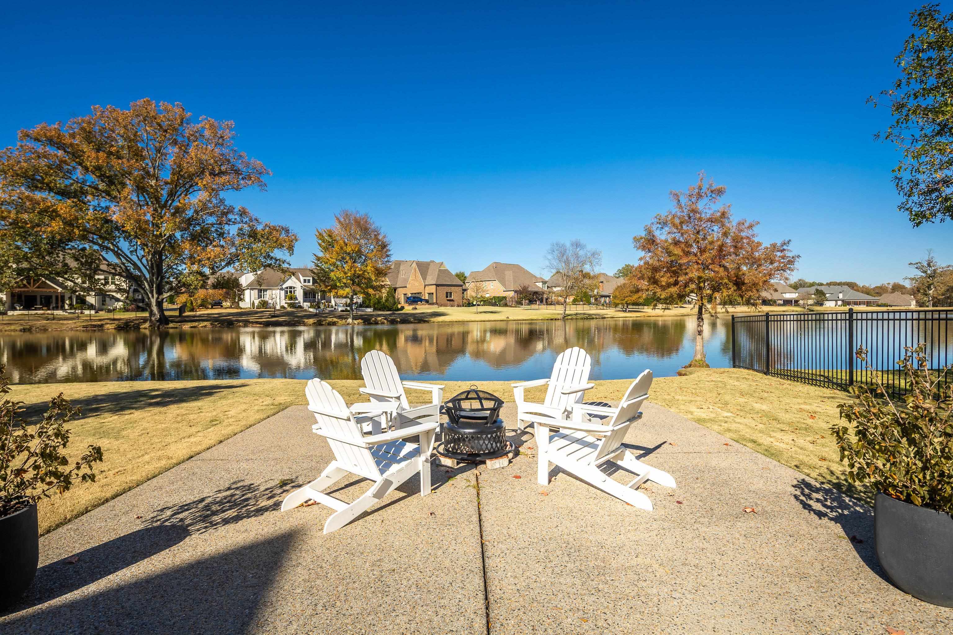 170 Twin Lakes Road Piperton, TN 38017 - Photo 31 of 40 Dock featuring a water view, a residential view, an outdoor fire pit, and a patio