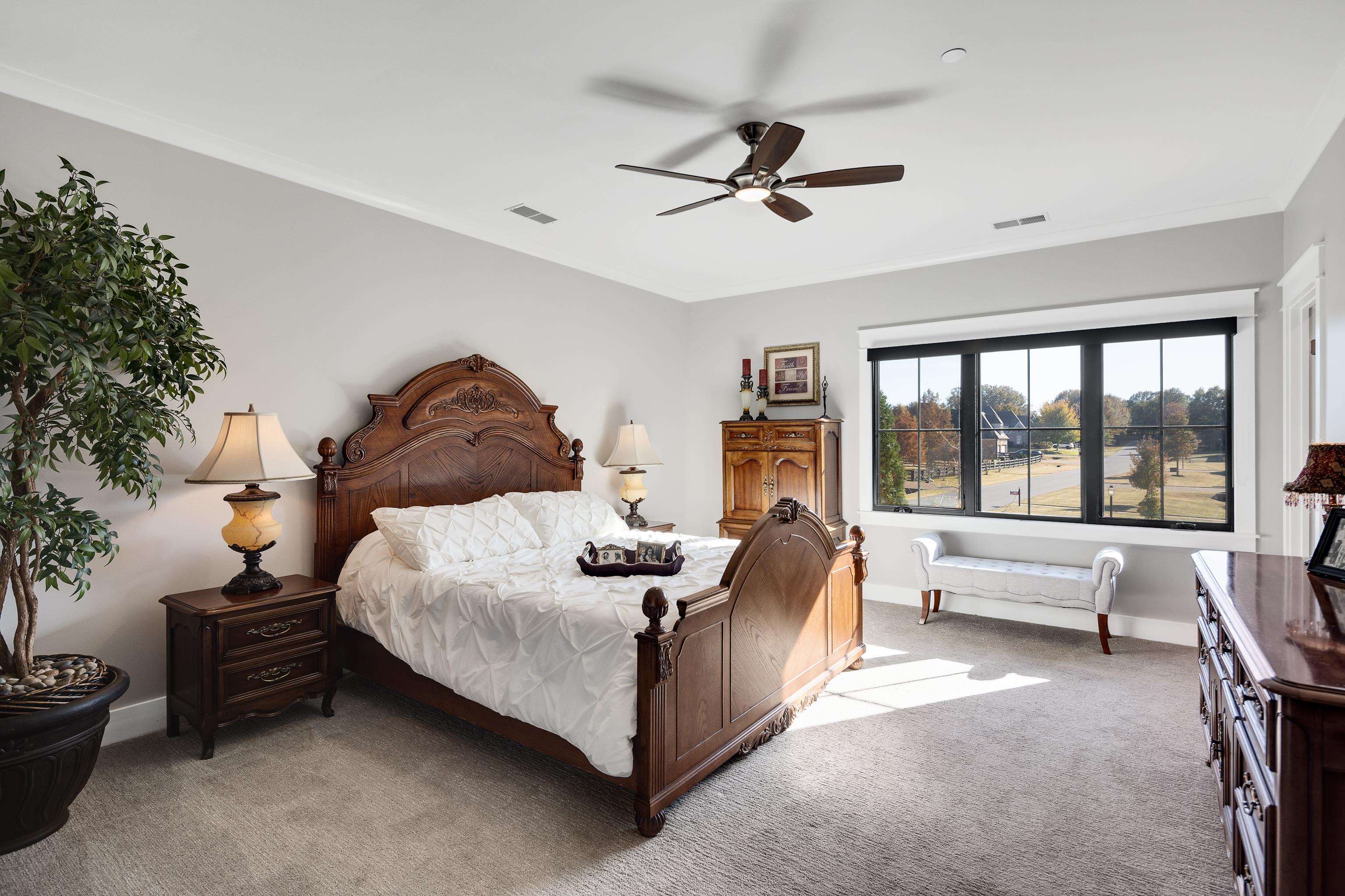 170 Twin Lakes Road Piperton, TN 38017 - Photo 36 of 40 Carpeted bedroom featuring a ceiling fan and baseboards
