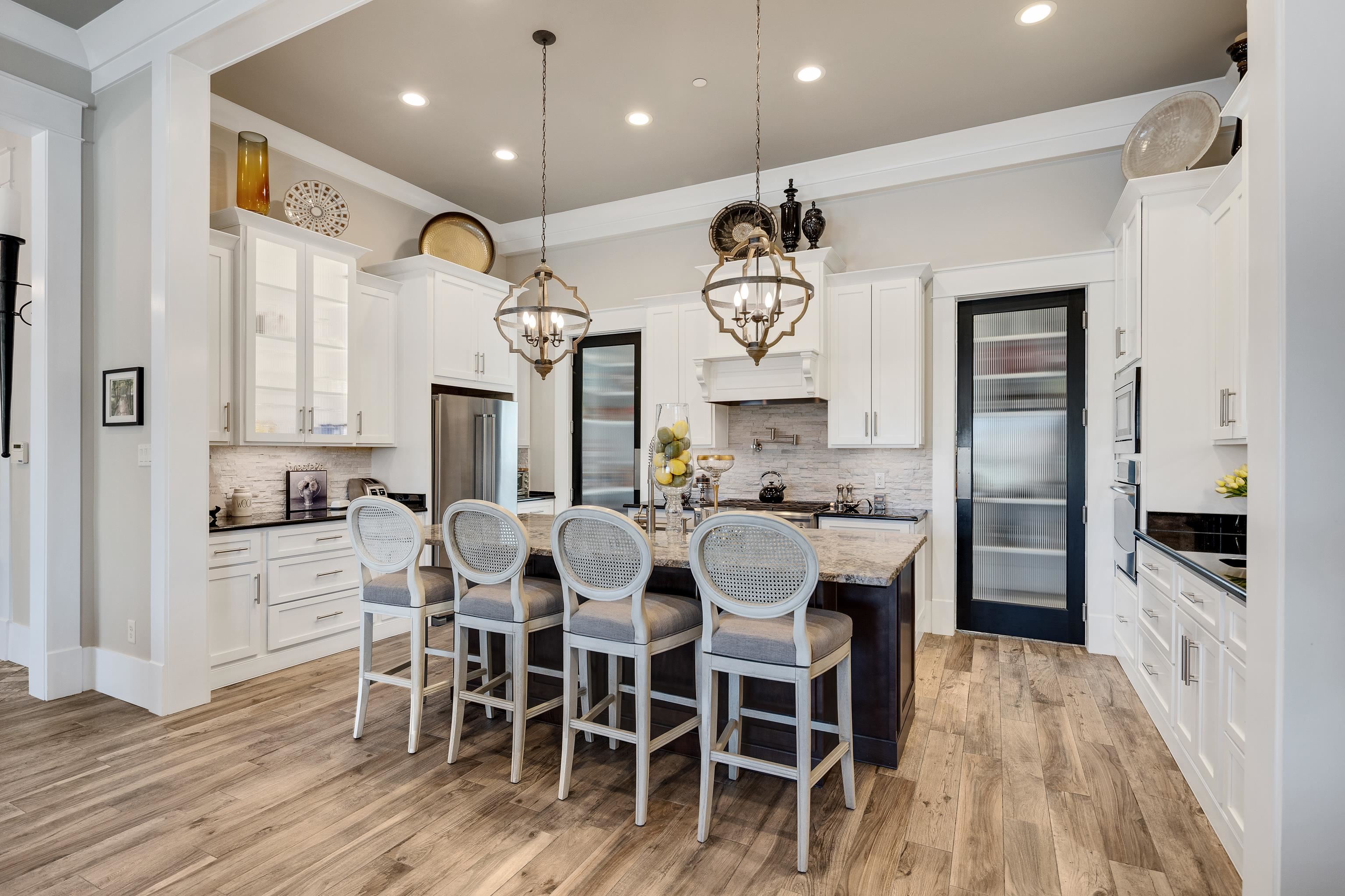 170 Twin Lakes Road Piperton, TN 38017 - Photo 4 of 40 Kitchen featuring pendant lighting, a breakfast bar, a center island with sink, dark stone countertops, and recessed lighting