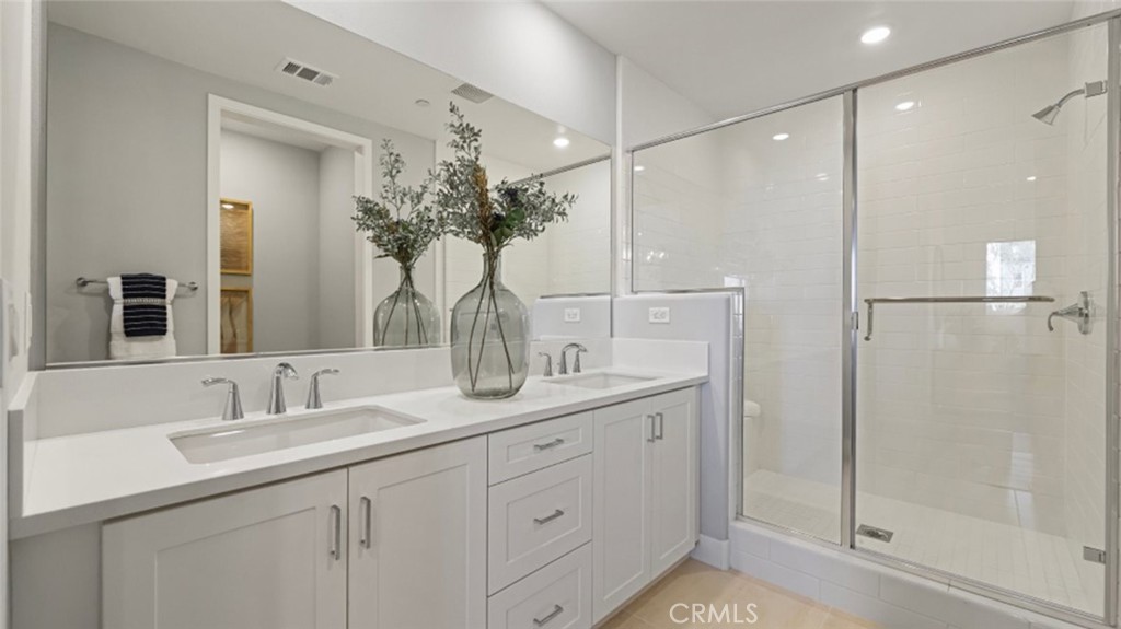 532 Neilson Irvine, CA 92618 - Photo 12 of 28 a bathroom with a shower sink and mirror
