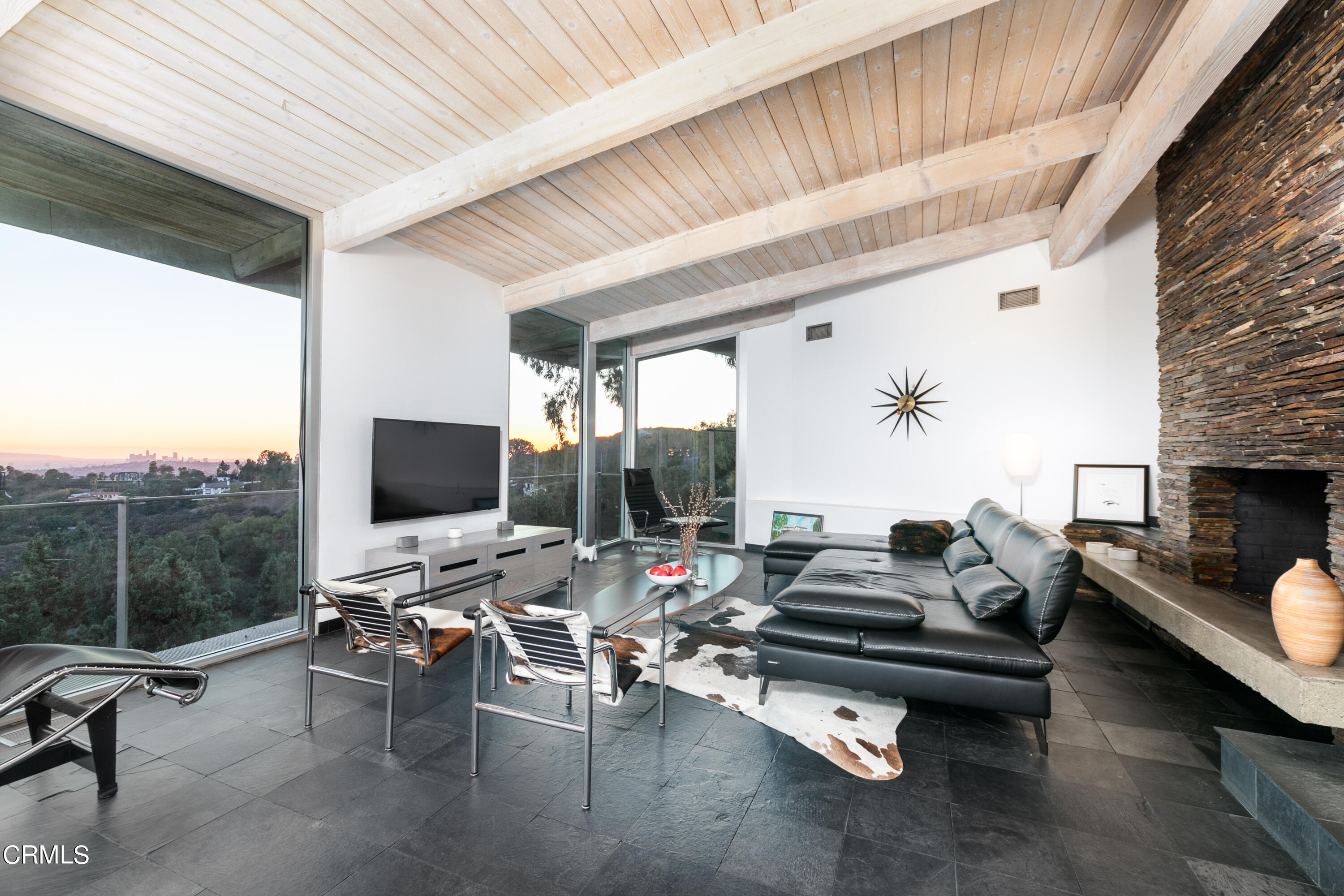 1290 Fairlawn Way Pasadena, CA 91105 - Photo 8 of 30 a living room with furniture a flat screen tv and a fireplace