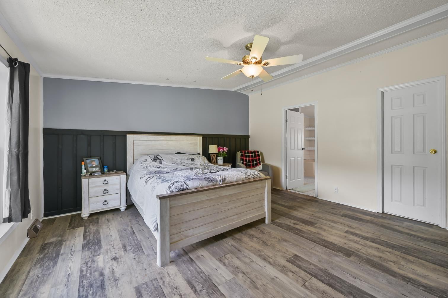 6439 Cedar Grove Road Big Sandy, TN 38221 - Photo 12 of 38 a bedroom with a bed and a chandelier