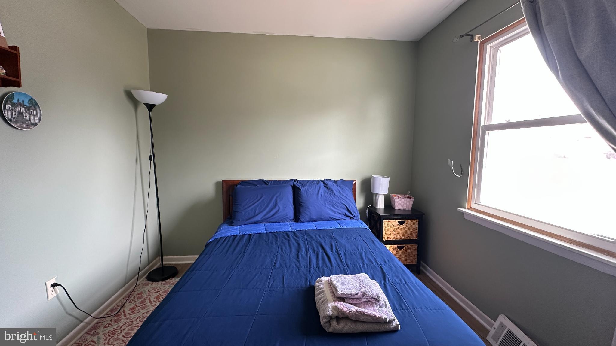 228 Embleton Road Owings Mills, MD 21117 - Photo 17 of 31 Cozy bedroom with calming green walls.
