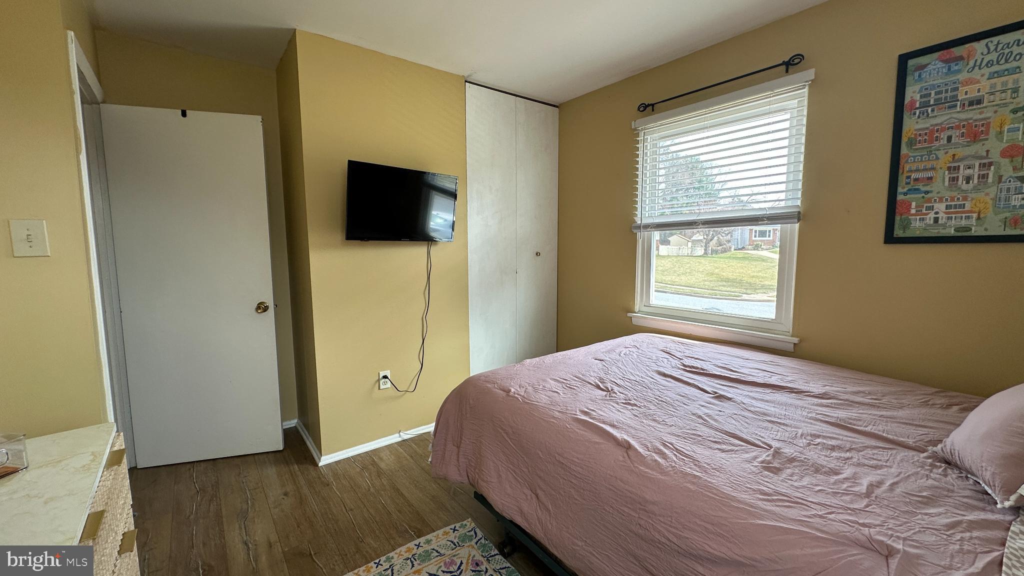 228 Embleton Road Owings Mills, MD 21117 - Photo 19 of 31 Cozy bedroom with natural light and charm.