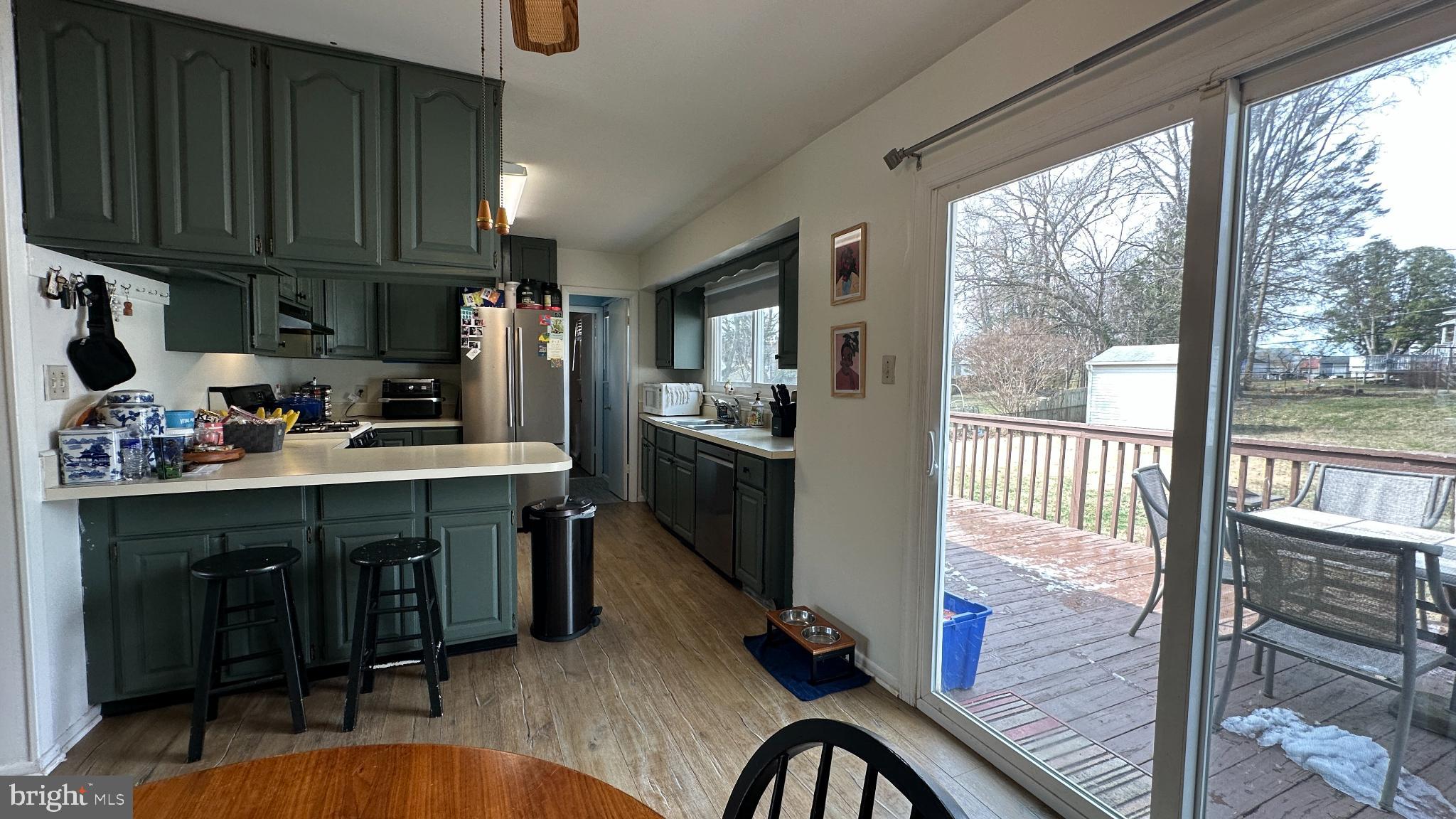 228 Embleton Road Owings Mills, MD 21117 - Photo 6 of 31 Modern kitchen with green cabinetry charm.