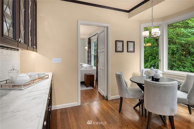 a view of a dining room with furniture window and outside view