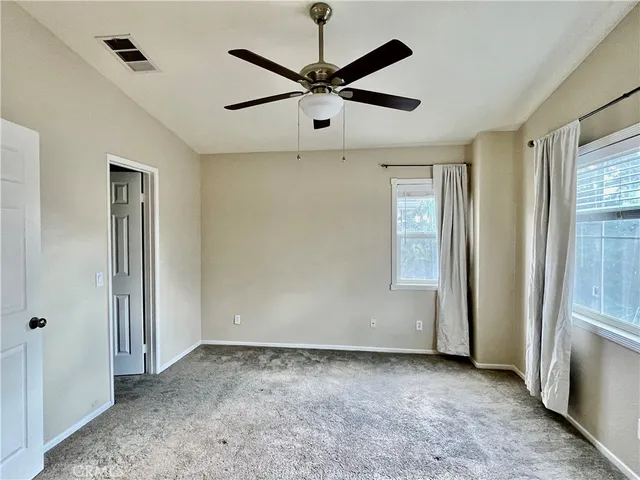 a view of a livingroom with a ceiling fan
