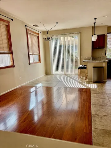 a view of a kitchen with wooden floor and a sink