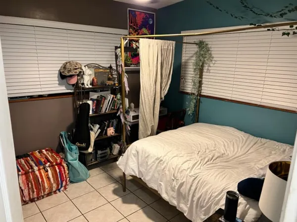 a bedroom with a bed and a closet