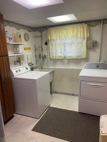 a utility room with washer and dryer