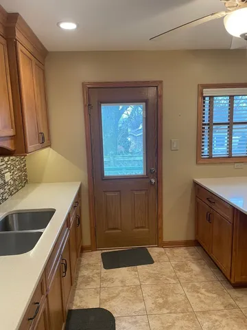 a kitchen that has a sink and a stove in it