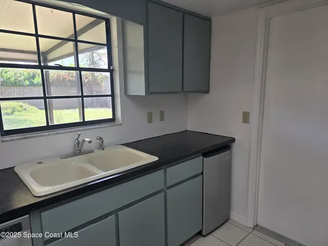 a bathroom with a sink and a window
