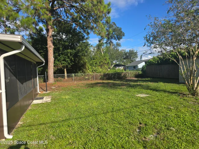 a backyard of a house with lots of green space