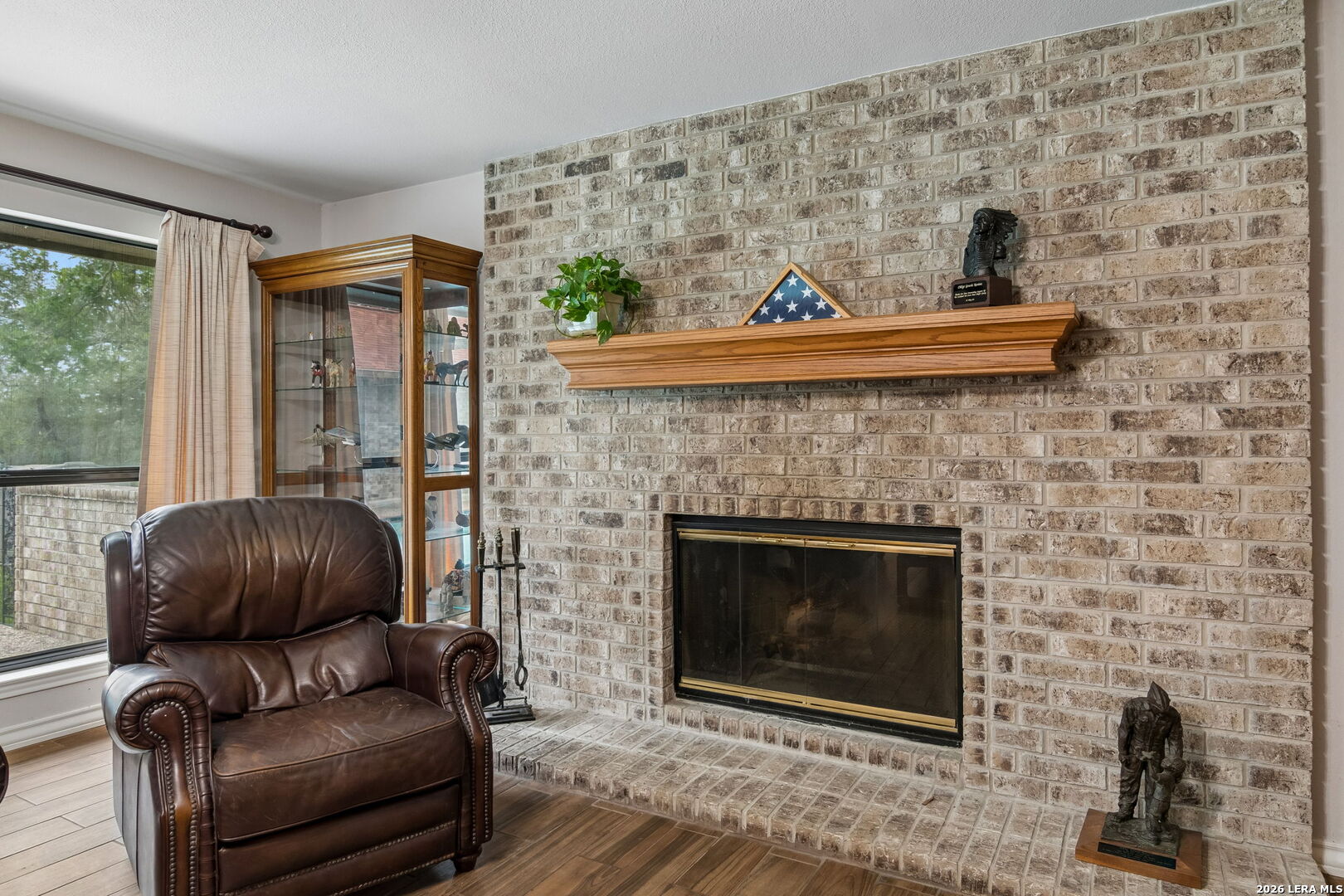 188 Guadalupe Ranch Lane Seguin, TX 78155 - Photo 31 of 56 a living room with furniture and a fireplace