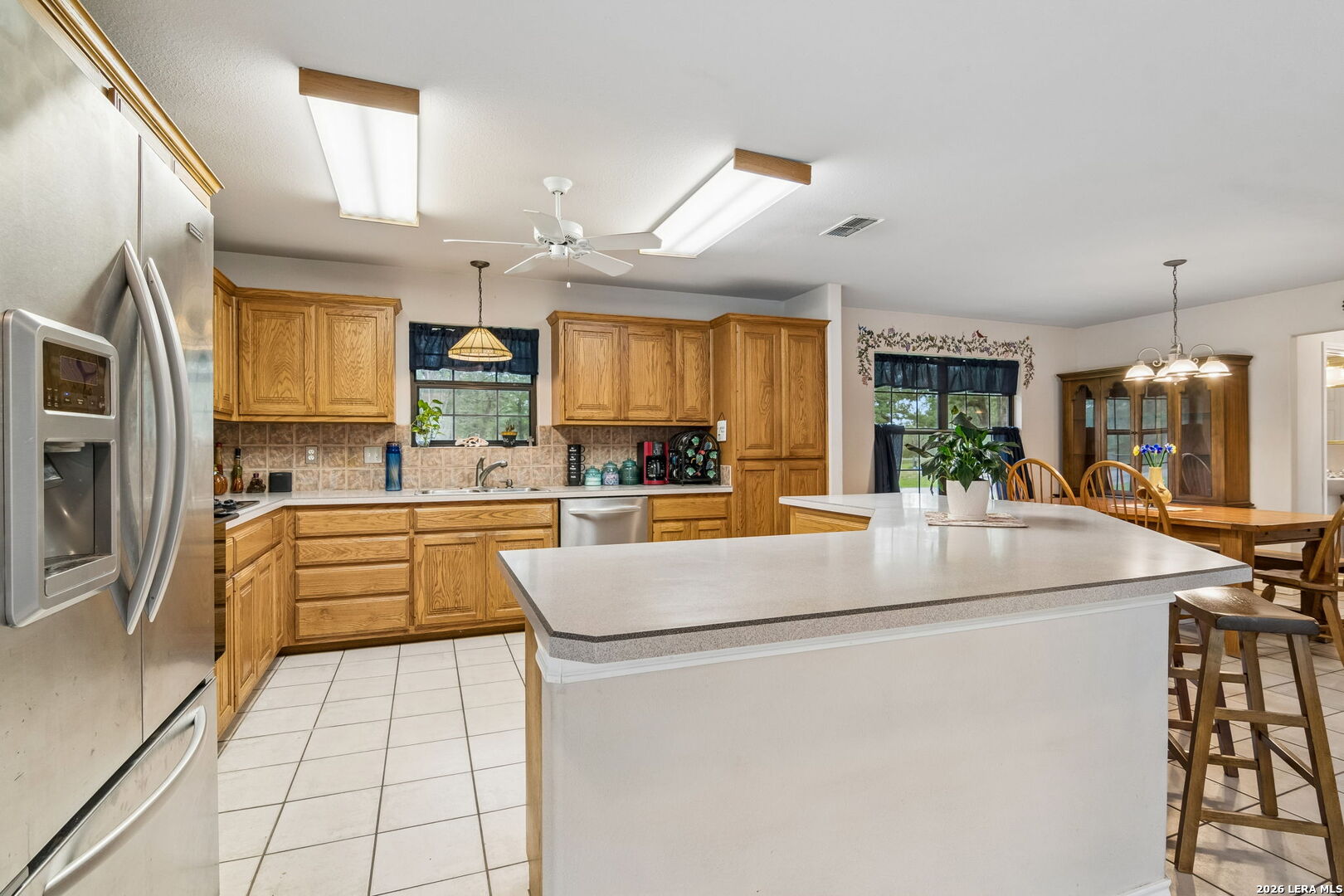 188 Guadalupe Ranch Lane Seguin, TX 78155 - Photo 41 of 56 a kitchen with stainless steel appliances granite countertop a sink and cabinets
