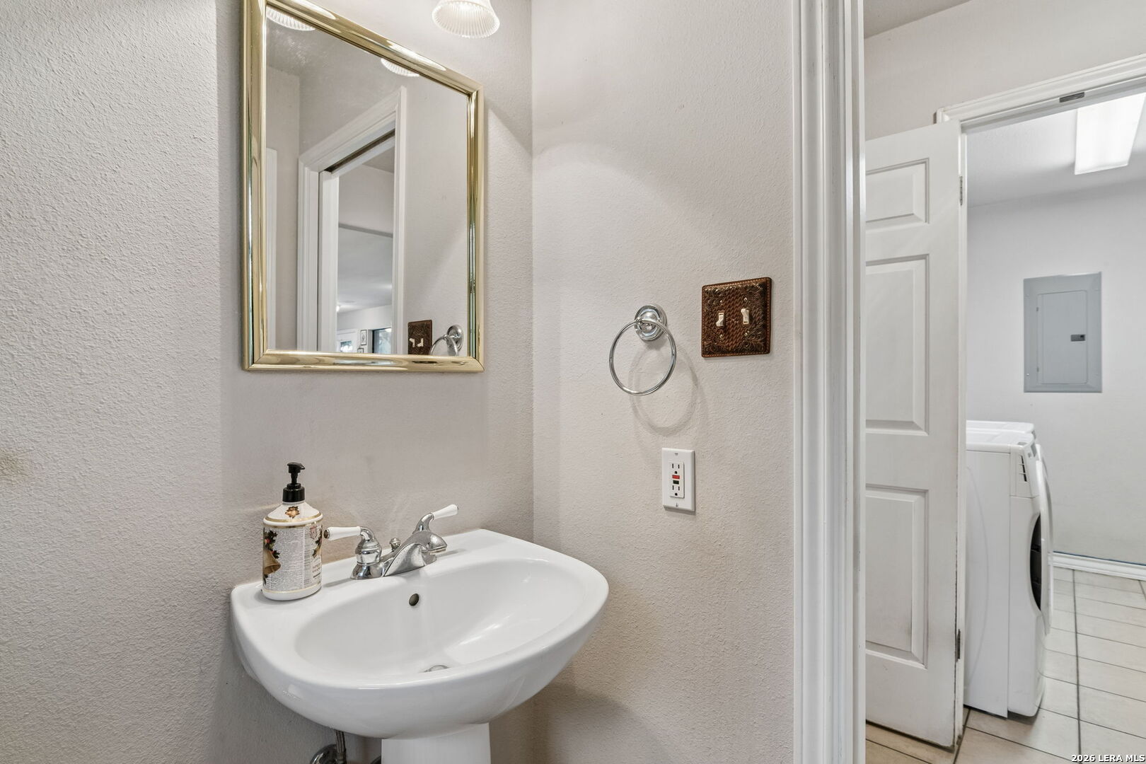 188 Guadalupe Ranch Lane Seguin, TX 78155 - Photo 50 of 56 a bathroom with a sink and mirror