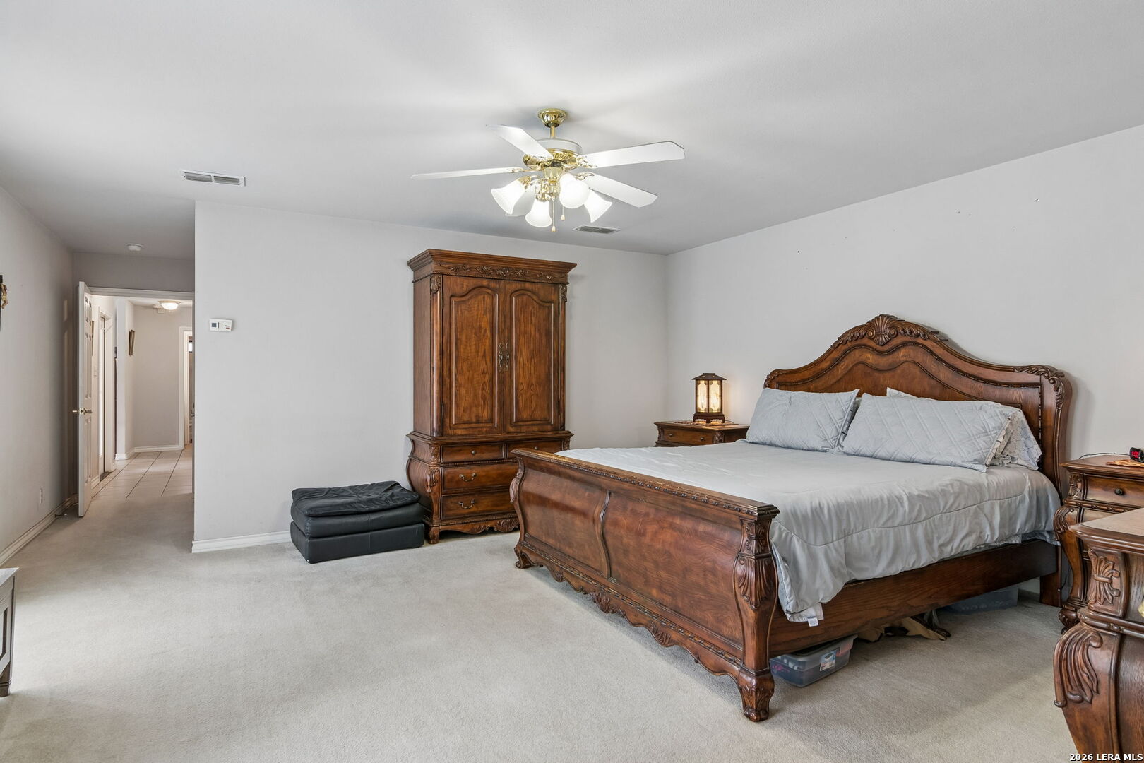 188 Guadalupe Ranch Lane Seguin, TX 78155 - Photo 53 of 56 a bedroom with a bed and a chandelier