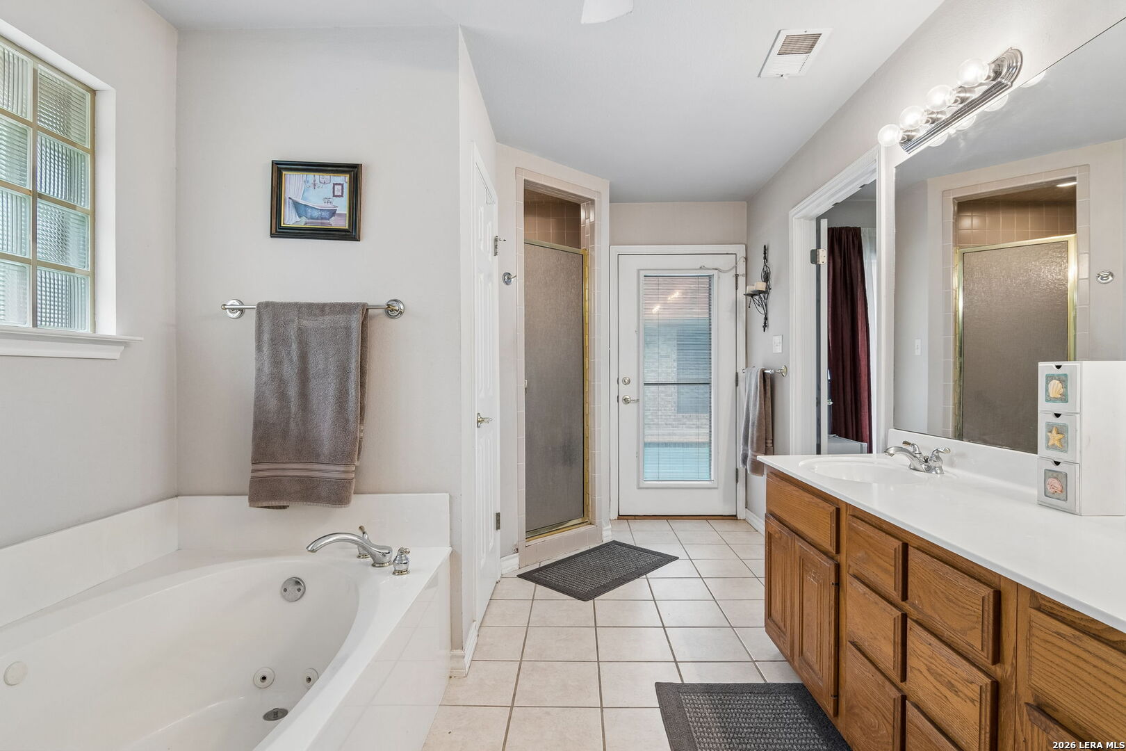 188 Guadalupe Ranch Lane Seguin, TX 78155 - Photo 54 of 56 a spacious bathroom with a tub sink shower and mirror