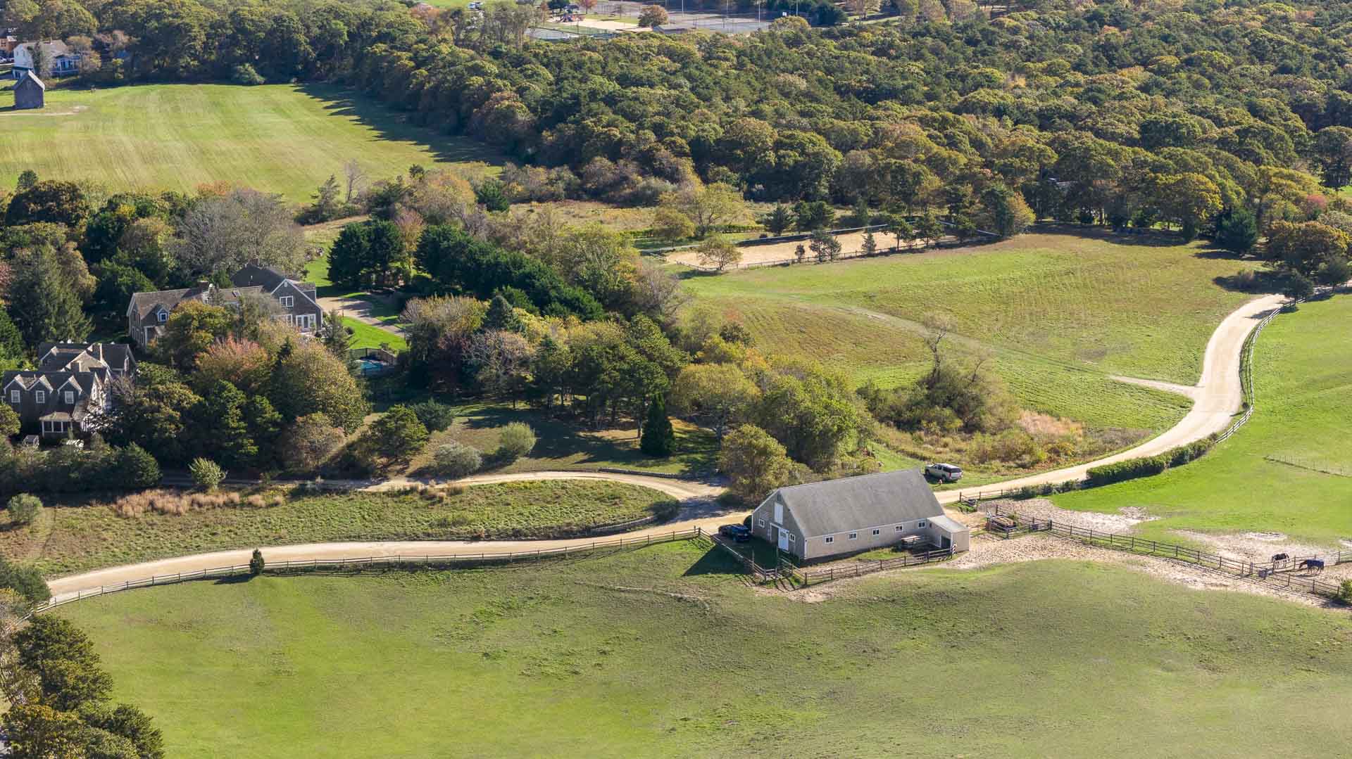 5 Louis Field Road Edgartown, MA 02539 - Photo 6 of 9 an aerial view of a house with swimming pool and lake view
