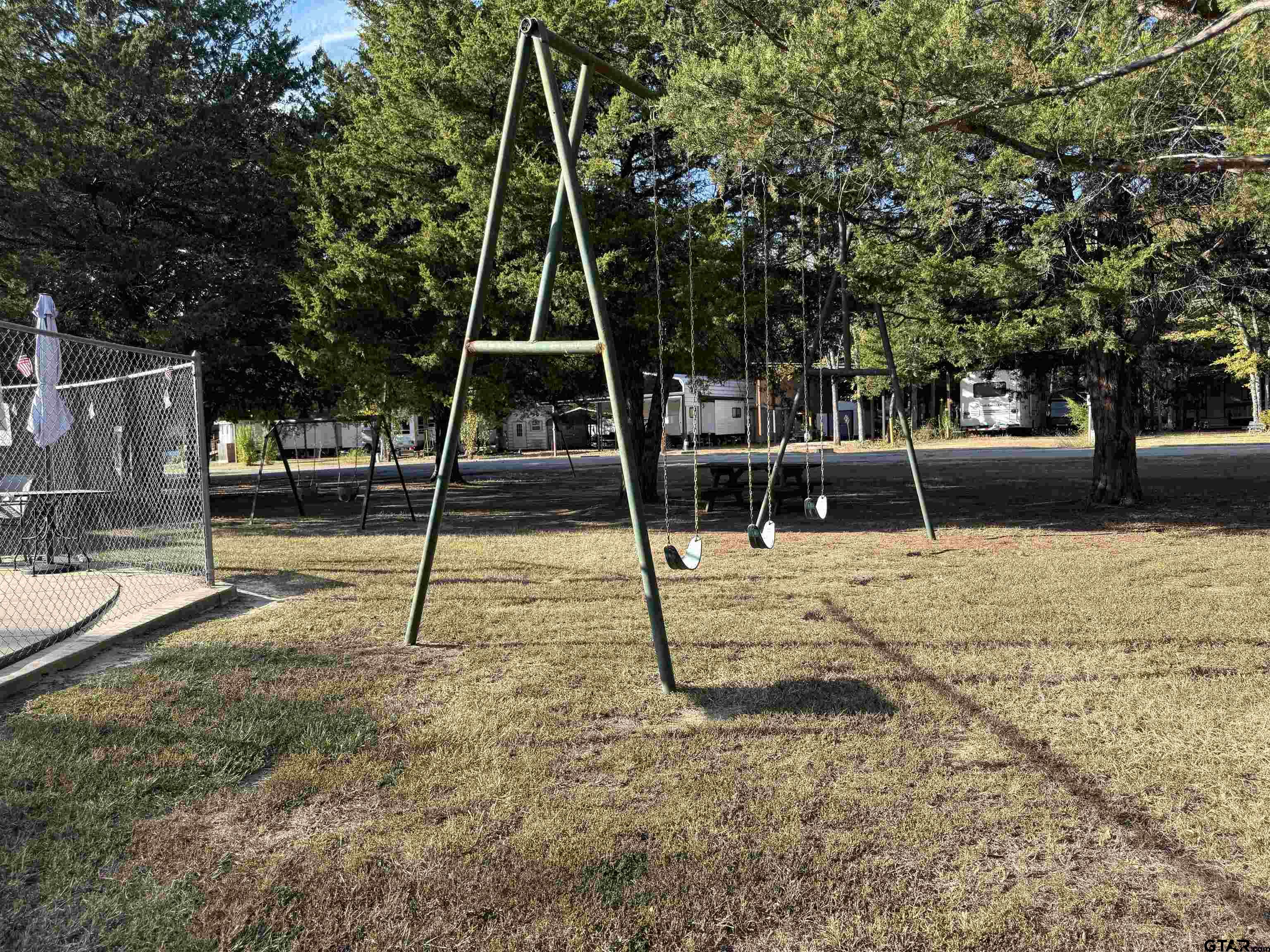 6435 FM 17 Yantis, TX 75497 - Photo 8 of 11 a view of a park with swings