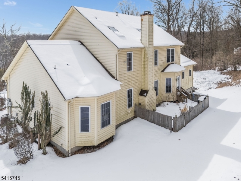 3 Elk Ridge Road Califon, NJ 07830 - Photo 12 of 15 a view of a white house with a large windows