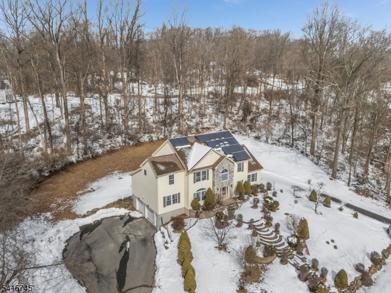 3 Elk Ridge Road Califon, NJ 07830 - Photo 2 of 15 a view of a house with a yard covered in snow