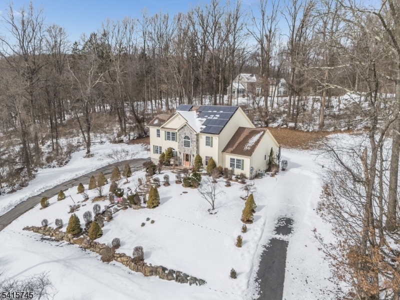 3 Elk Ridge Road Califon, NJ 07830 - Photo 7 of 15 a view of a house with a snow in the yard