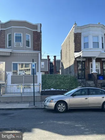 a car parked in front of a house