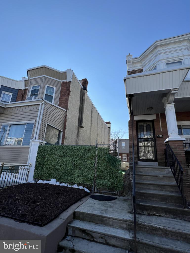 5648 Pine Street Philadelphia, PA 19143 - Photo 4 of 7 a front view of a house with plants