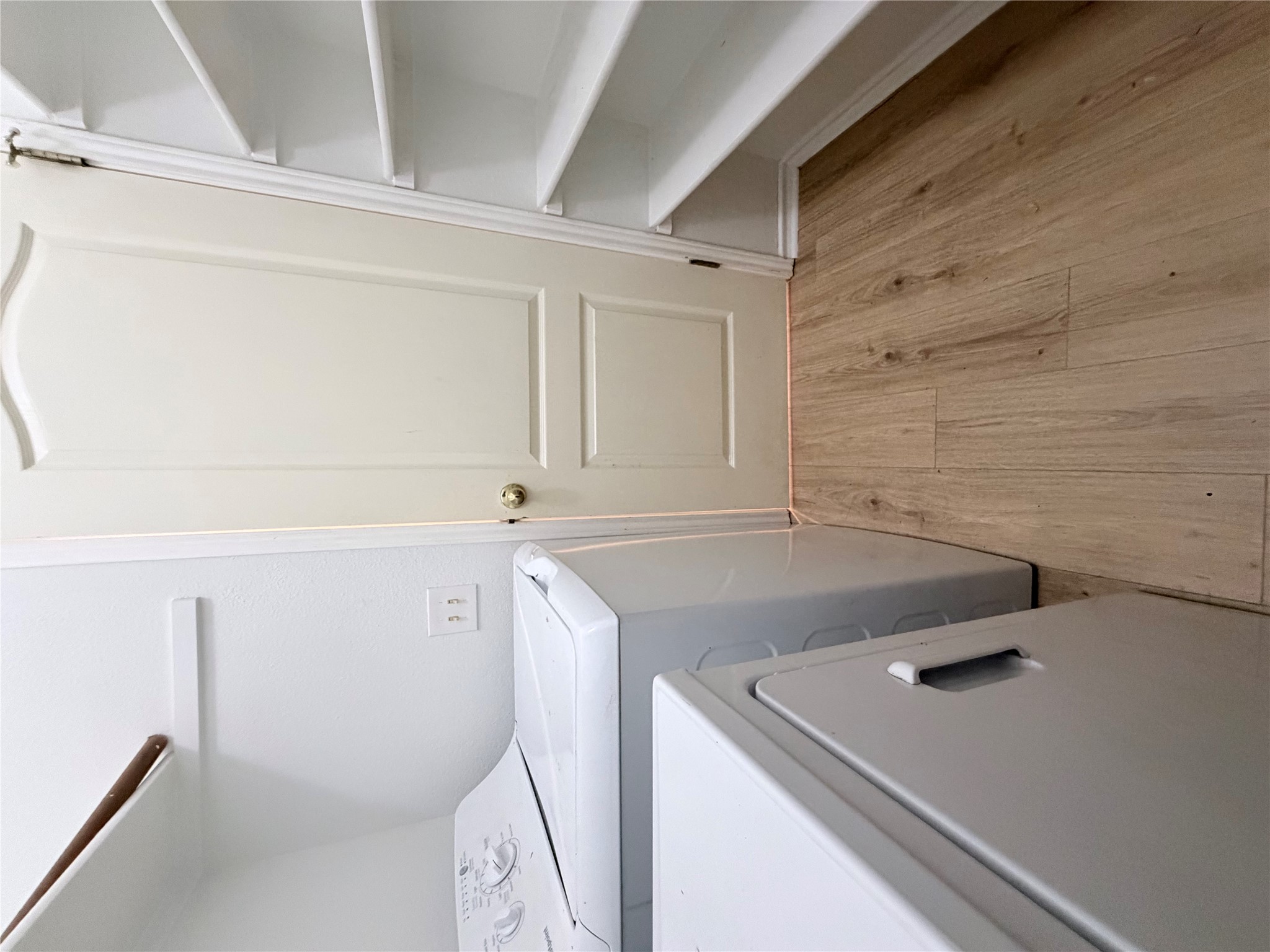 20809 Pacers Gait Lane Pflugerville, TX 78660 - Photo 20 of 23 Laundry room featuring light wood-type flooring and washing machine and dryer