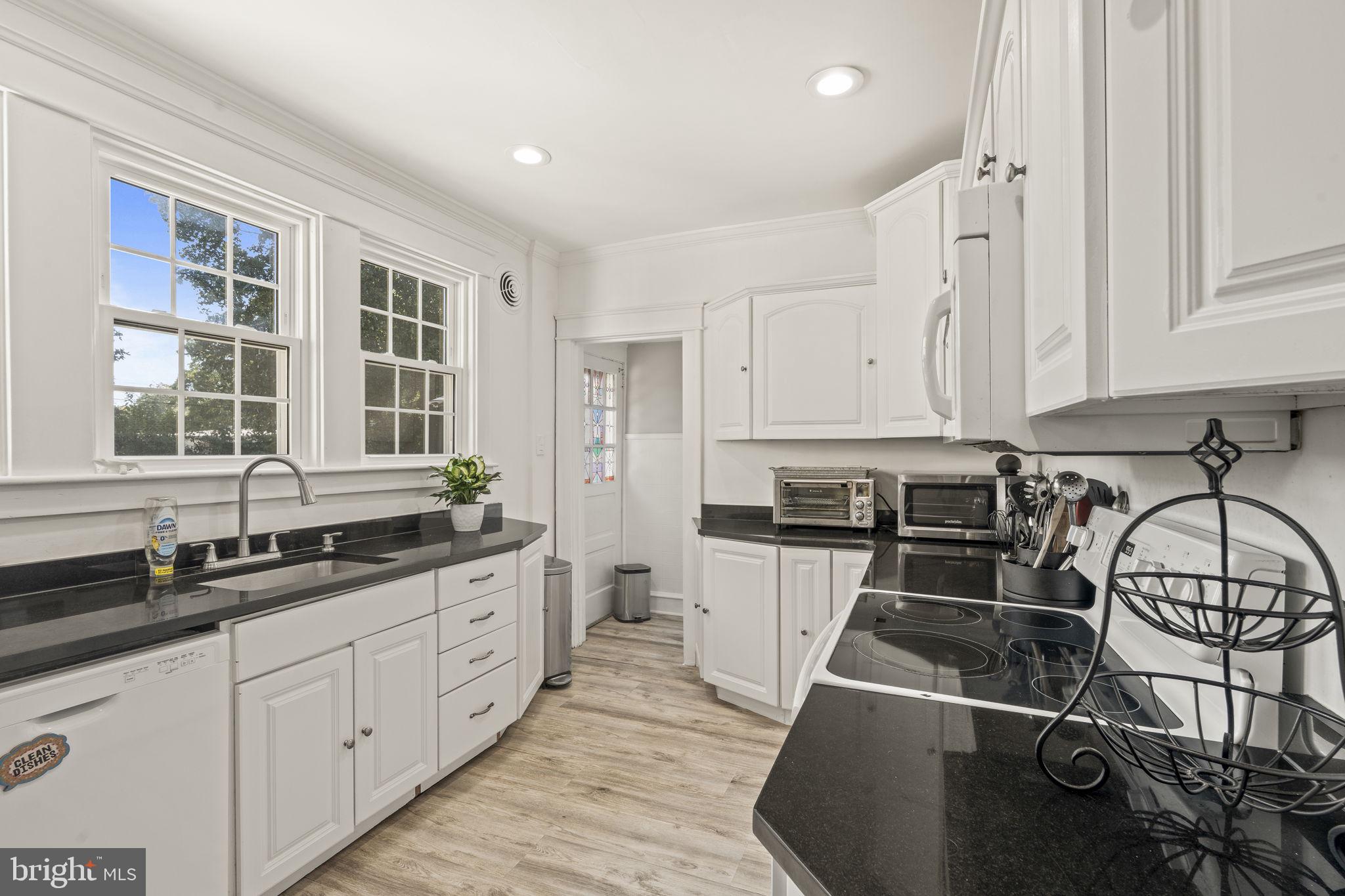 4161 Orchard Lane Philadelphia, PA 19154 - Photo 22 of 42 a kitchen with granite countertop a sink and cabinets