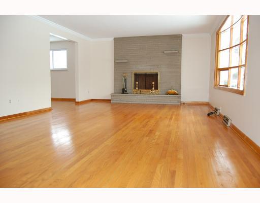 3930 Shepard Road Gibsonia, PA 15044 - Photo 2 of 12 Living Room. *STONE FIREPLACE ~ HARDWOOD FLOORS ~ PLASTER CROWN MOLDING ~ BAY WINDOW