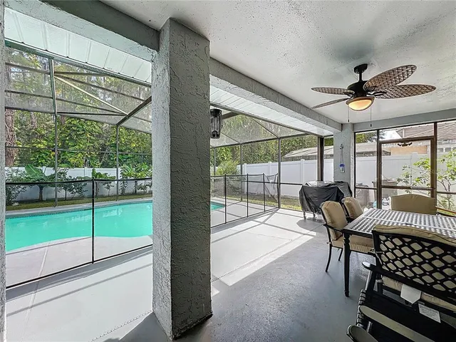 a view of a big room with wooden floor windows and outdoor view