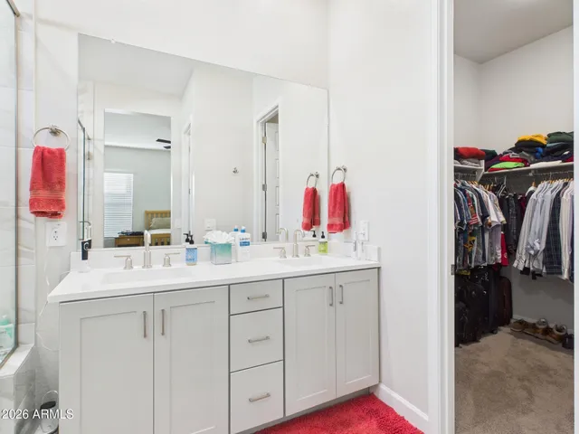 a bedroom with a bed and a table