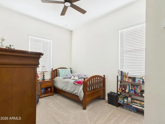 a bathroom with a sink vanity mirror and toilet