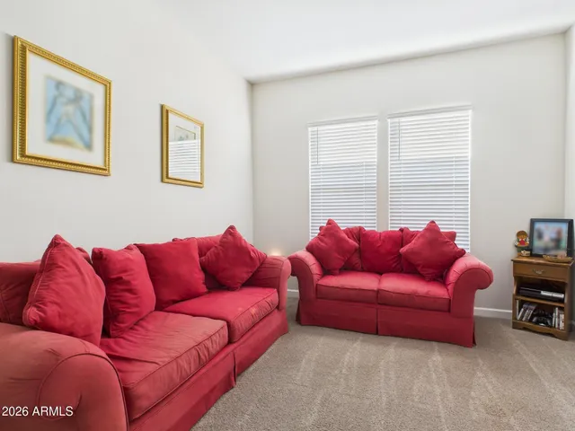 a view of balcony with chairs and a potted plant